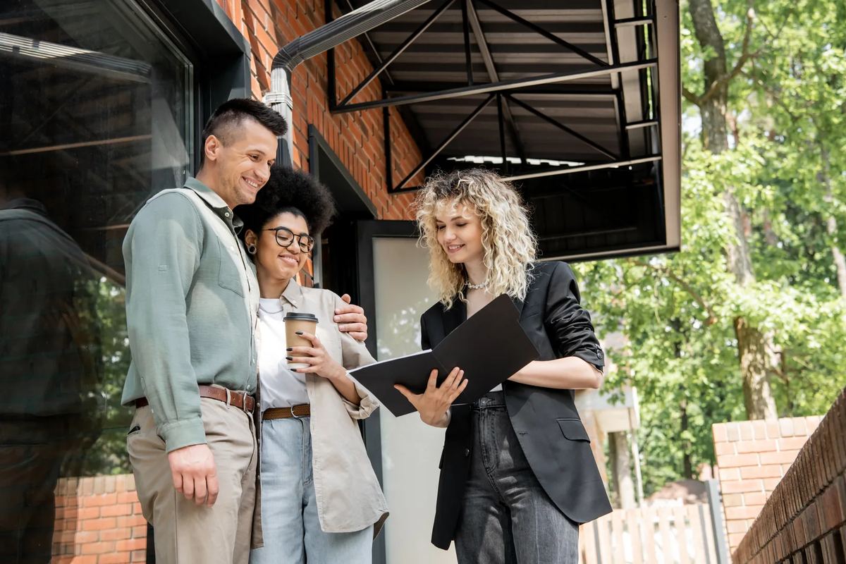 A leasing agent meeting with prospective residents